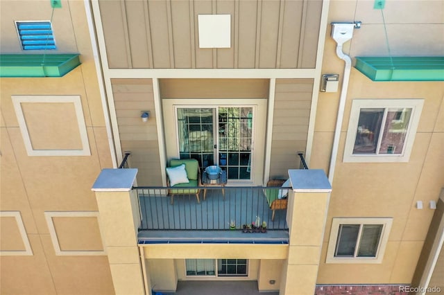 exterior space featuring board and batten siding and visible vents