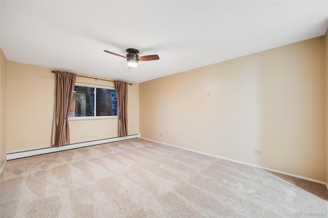 empty room featuring light carpet, baseboard heating, and ceiling fan