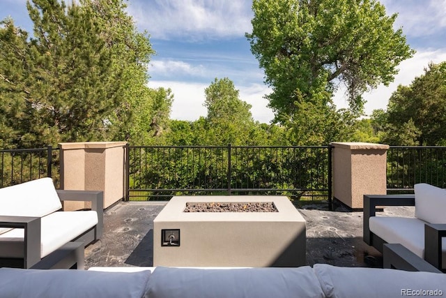 2535 W 115th Dr, Westminster, CO 80234 - view of patio with an outdoor living space with a fire pit