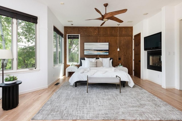 2535 W 115th Dr, Westminster, CO 80234 - bedroom featuring multiple windows, light wood finished floors, and baseboards