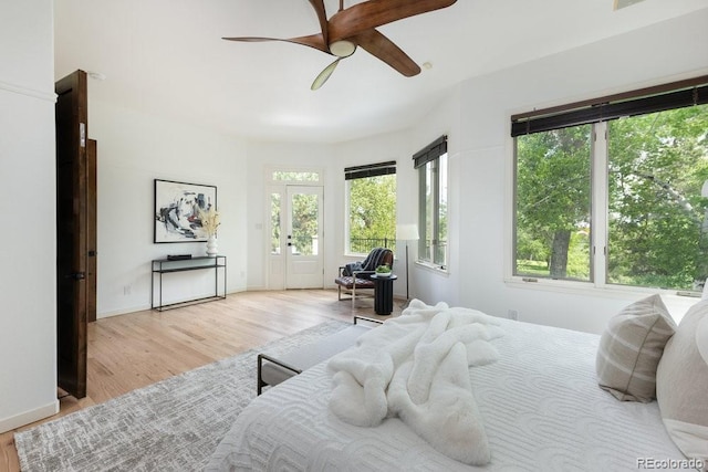 2535 W 115th Dr, Westminster, CO 80234 - bedroom featuring multiple windows, wood finished floors, baseboards, and ceiling fan