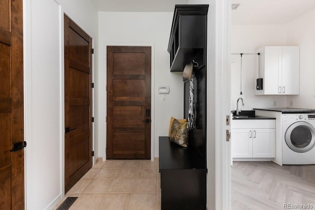 2535 W 115th Dr, Westminster, CO 80234 - laundry area featuring washer / dryer and cabinet space
