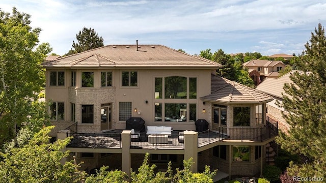 2535 W 115th Dr, Westminster, CO 80234 - back of house featuring outdoor lounge area, a deck, and a tile roof