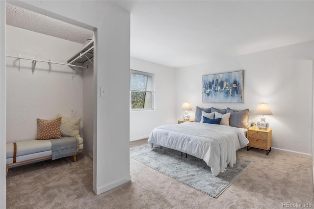 bedroom featuring carpet floors and baseboards