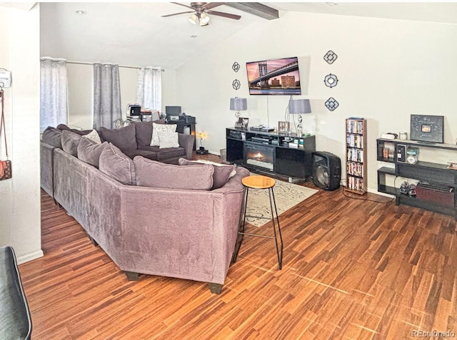 living room featuring wood-type flooring, lofted ceiling with beams, and ceiling fan