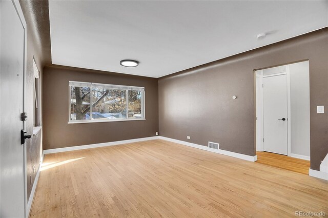 unfurnished room featuring light hardwood / wood-style flooring