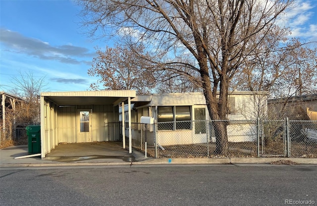 view of front of property featuring a carport