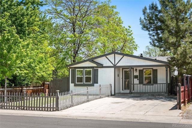 1522 Willow St, Denver, CO 80220 - view of front of house featuring covered porch and a fenced front yard