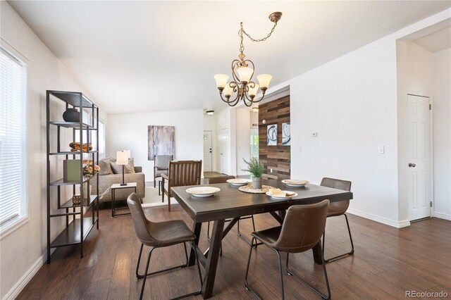 1522 Willow St, Denver, CO 80220 - dining space featuring baseboards, dark wood finished floors, and a chandelier
