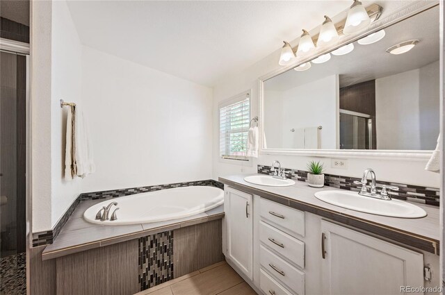 1522 Willow St, Denver, CO 80220 - bathroom with a stall shower, double vanity, and a garden tub