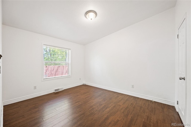 1522 Willow St, Denver, CO 80220 - unfurnished bedroom featuring dark wood finished floors and baseboards