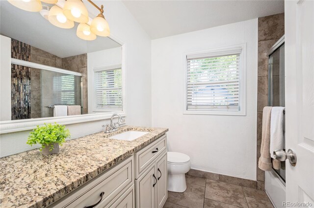 1522 Willow St, Denver, CO 80220 - bathroom with vanity, tiled shower, toilet, tile patterned floors, and baseboards