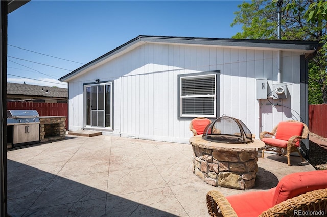 1522 Willow St, Denver, CO 80220 - back of property featuring an outdoor fire pit, a patio, and area for grilling