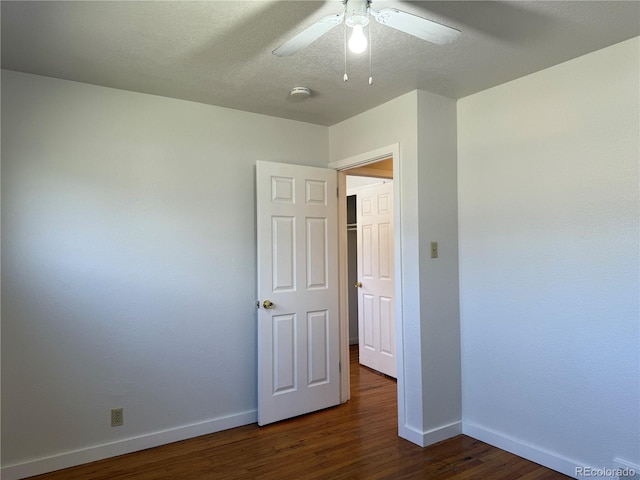 1906 Larkspur Dr, Fort Collins, CO 80521 - unfurnished room featuring a textured ceiling, baseboards, a ceiling fan, and dark wood finished floors