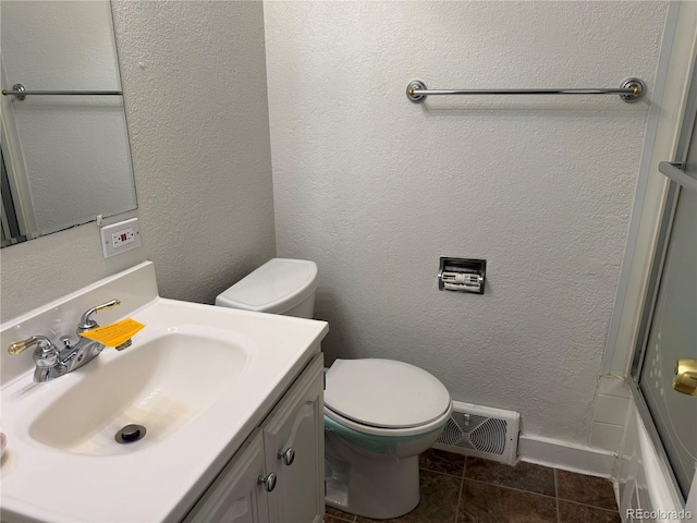 1906 Larkspur Dr, Fort Collins, CO 80521 - bathroom featuring vanity, baseboards, a textured wall, toilet, and visible vents