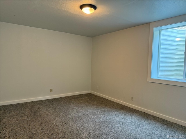 1906 Larkspur Dr, Fort Collins, CO 80521 - carpeted spare room with baseboards and a textured ceiling