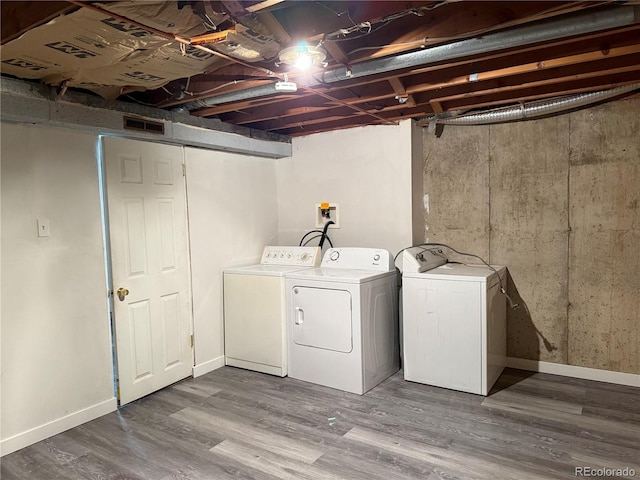 1906 Larkspur Dr, Fort Collins, CO 80521 - laundry room featuring baseboards, wood finished floors, separate washer and dryer, and laundry area