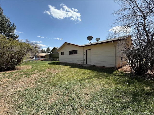 1906 Larkspur Dr, Fort Collins, CO 80521 - back of house with fence and a lawn