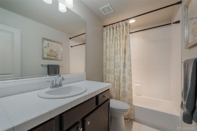 full bathroom with vanity, toilet, tile patterned flooring, and shower / bath combo