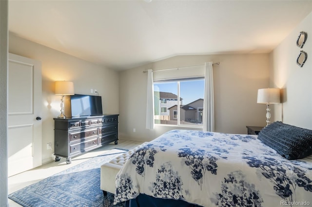 bedroom featuring vaulted ceiling