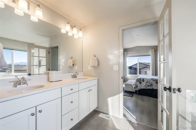 bathroom with tile patterned flooring and vanity