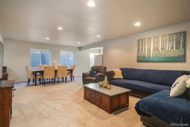 carpeted living room with a textured ceiling