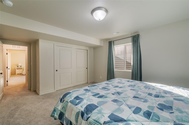 carpeted bedroom with a closet