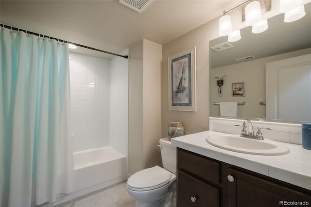 full bathroom featuring shower / tub combo with curtain, vanity, and toilet