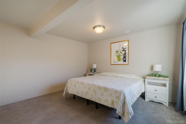 bedroom with beam ceiling and carpet floors