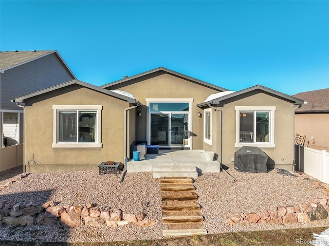 back of property featuring a patio