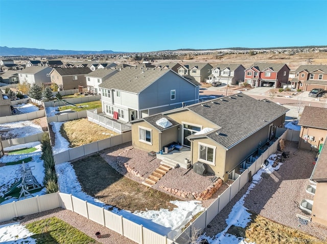 birds eye view of property with a mountain view