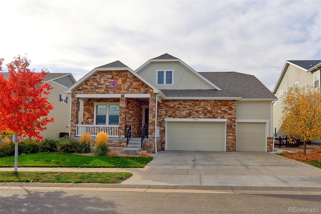 craftsman-style house with a garage, covered porch, and a front lawn