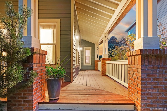 view of exterior entry at dusk