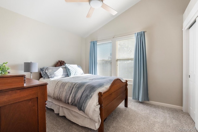 bedroom with ceiling fan, light colored carpet, and lofted ceiling