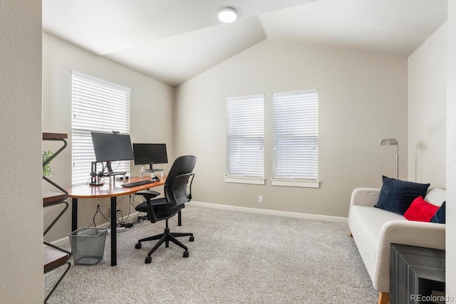 office with vaulted ceiling and carpet flooring