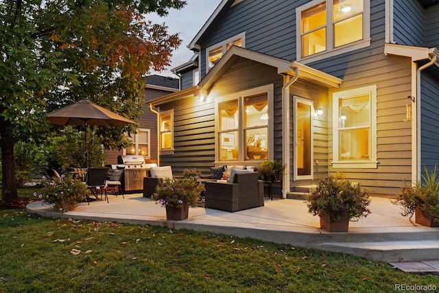 back of property with a patio and an outdoor living space