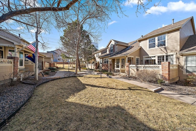 view of yard with fence and a residential view