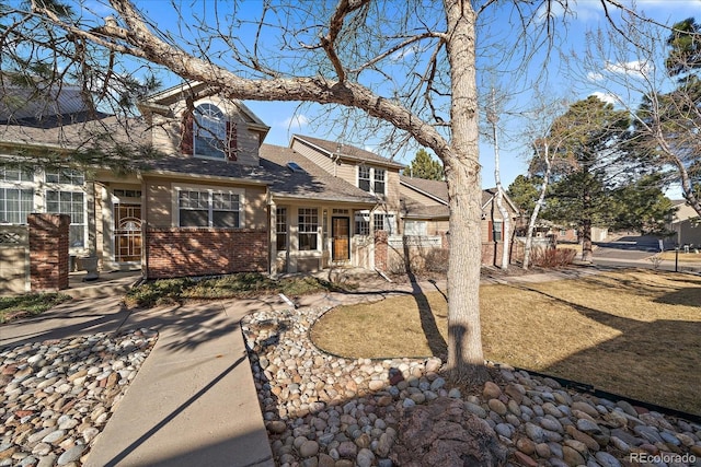 view of front of house featuring brick siding