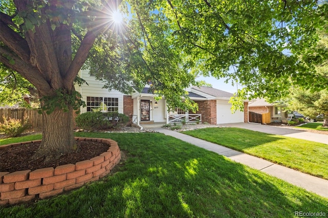 8035 S Garfield Way, Centennial, CO 80122 - view of property hidden behind natural elements featuring brick siding, driveway, and a garage