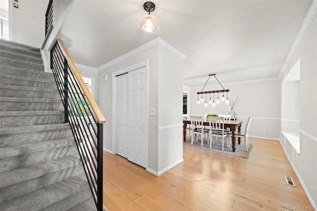8035 S Garfield Way, Centennial, CO 80122 - stairway featuring hardwood / wood-style flooring, ornamental molding, and baseboards