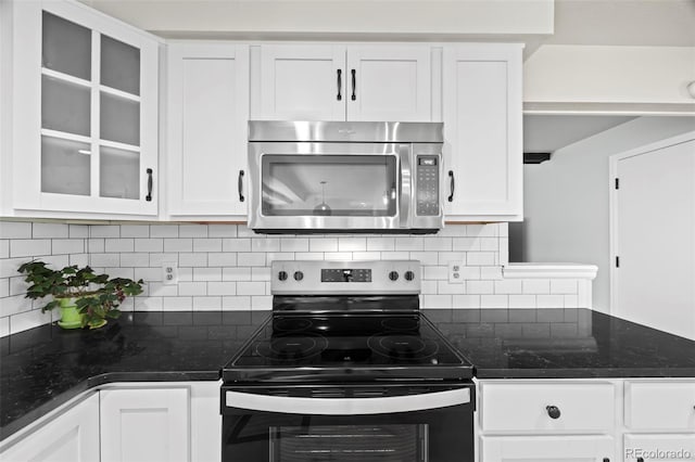 8035 S Garfield Way, Centennial, CO 80122 - kitchen featuring stainless steel appliances, white cabinets, glass insert cabinets, and backsplash