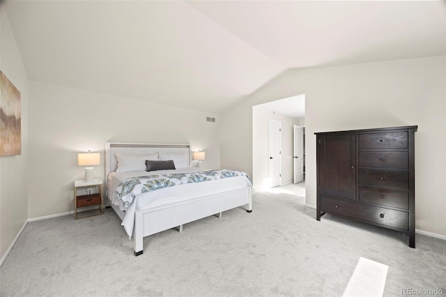 8035 S Garfield Way, Centennial, CO 80122 - bedroom with lofted ceiling, light carpet, and baseboards
