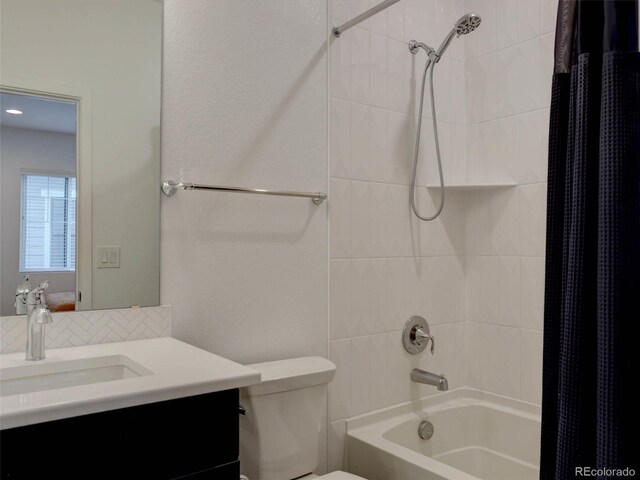 11246 Bellsong Ln, Littleton, CO 80125 - full bathroom with shower / tub combo, vanity, and tasteful backsplash