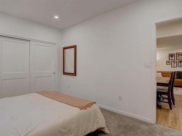 11246 Bellsong Ln, Littleton, CO 80125 - bedroom featuring light carpet, recessed lighting, and a closet