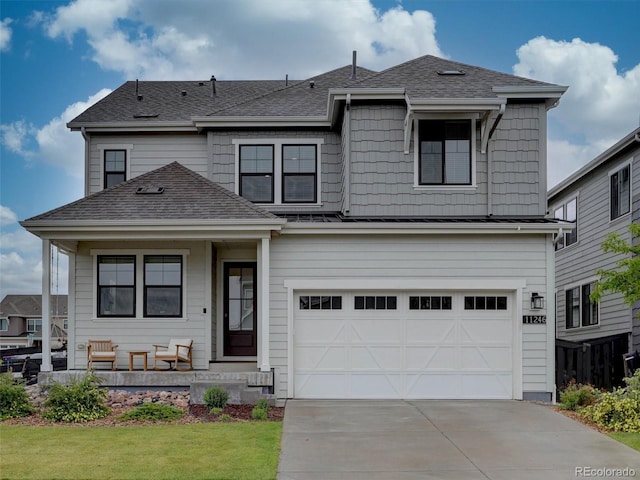 11246 Bellsong Ln, Littleton, CO 80125 - view of front of property featuring a garage, concrete driveway, a shingled roof, and covered porch