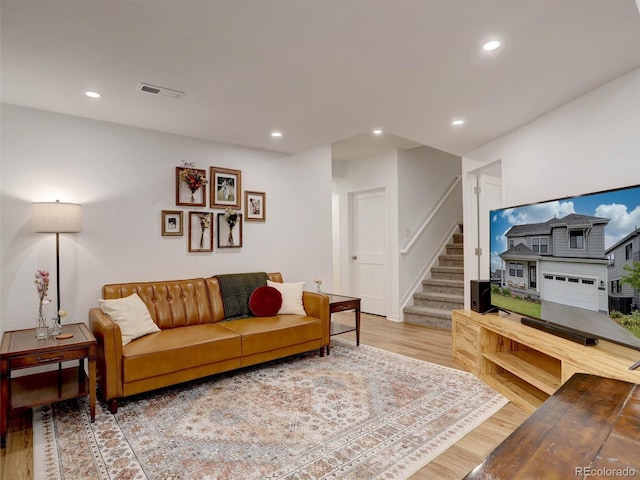 11246 Bellsong Ln, Littleton, CO 80125 - living room featuring light wood-style floors, stairway, and recessed lighting
