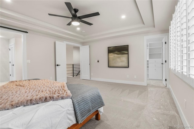 10 Summit Ash, Littleton, CO 80127 - bedroom with a tray ceiling, a walk in closet, recessed lighting, baseboards, and a ceiling fan
