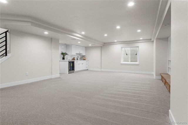 10 Summit Ash, Littleton, CO 80127 - basement featuring recessed lighting, beverage cooler, light carpet, baseboards, and wet bar