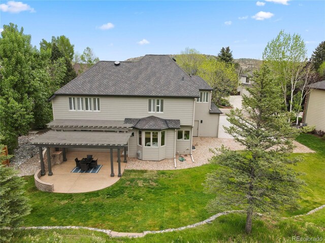 10 Summit Ash, Littleton, CO 80127 - rear view of house featuring a patio area, a lawn, roof with shingles, and a pergola