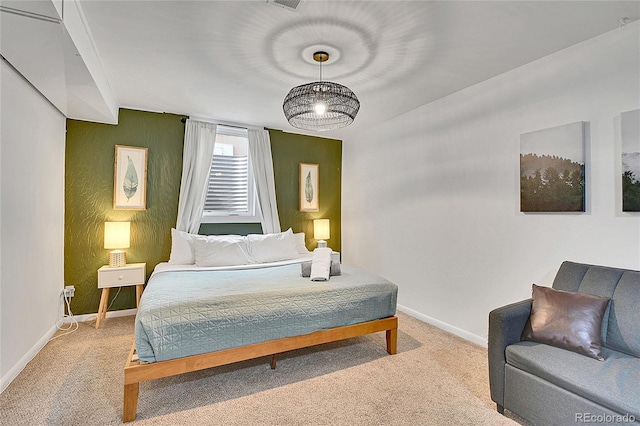 carpeted bedroom featuring baseboards